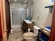 Bathroom with tub shower combo, vanity, and linen storage at 3149 E 900 S, Flat Rock, IN 47234