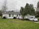 Ranch-style home with gray siding and a small yard at 3149 E 900 S, Flat Rock, IN 47234
