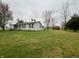 Ranch-style home with satellite dishes and large yard at 3149 E 900 S, Flat Rock, IN 47234