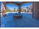 Brick patio with fire pit, overlooking pool and landscaped yard at 4812 N 300E, Greenfield, IN 46140