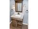 Modern bathroom with marble vanity and wood accents at 700 S Ohio St, Sheridan, IN 46069