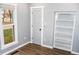Bright bedroom with wood flooring and built-in shelving at 700 S Ohio St, Sheridan, IN 46069