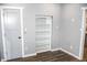 Bright bedroom with wood flooring and built-in shelving at 700 S Ohio St, Sheridan, IN 46069
