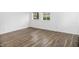 Bright bonus room with wood-look flooring and two windows at 700 S Ohio St, Sheridan, IN 46069