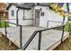 Rear deck with cable railing and wood flooring at 700 S Ohio St, Sheridan, IN 46069