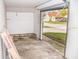 Unfinished garage with open door and view of the street at 700 S Ohio St, Sheridan, IN 46069