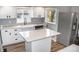 Modern kitchen featuring white cabinets, quartz countertops, and stainless steel appliances at 700 S Ohio St, Sheridan, IN 46069