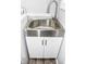 Stainless steel laundry sink with white cabinet at 700 S Ohio St, Sheridan, IN 46069