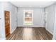 Living room with hardwood floors, gray walls and built-in hutch at 700 S Ohio St, Sheridan, IN 46069