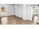 Open living room with hardwood floors, and stained glass door at 700 S Ohio St, Sheridan, IN 46069