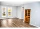 Spacious living room with hardwood floors and large windows at 700 S Ohio St, Sheridan, IN 46069