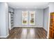 Bright living room featuring hardwood floors and a barn door at 700 S Ohio St, Sheridan, IN 46069