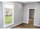 Bright office with gray walls, wood flooring, and a view of the backyard at 700 S Ohio St, Sheridan, IN 46069