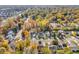 Aerial view of house and neighborhood during autumn at 11411 Shady Hollow Ln, Indianapolis, IN 46229