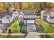 Aerial view of two-story house on tree-lined street at 11411 Shady Hollow Ln, Indianapolis, IN 46229