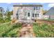 Spacious backyard with patio, shed, and autumn leaves at 11411 Shady Hollow Ln, Indianapolis, IN 46229