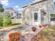 Cozy backyard patio with autumn mums and brick path at 11411 Shady Hollow Ln, Indianapolis, IN 46229