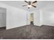 Bedroom with ceiling fan, carpet, and access to closet at 11411 Shady Hollow Ln, Indianapolis, IN 46229
