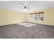 Large bedroom with neutral walls, carpet, and three windows at 11411 Shady Hollow Ln, Indianapolis, IN 46229