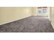 Simple carpeted bedroom with two windows at 11411 Shady Hollow Ln, Indianapolis, IN 46229