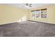 Bright bedroom with three windows and ceiling fan at 11411 Shady Hollow Ln, Indianapolis, IN 46229