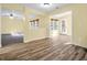 Bright dining area with hardwood floors and access to a sunroom at 11411 Shady Hollow Ln, Indianapolis, IN 46229