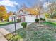 Two-story brick home with attached garage and landscaping at 11411 Shady Hollow Ln, Indianapolis, IN 46229