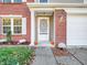 Inviting front entrance with a brick facade and pumpkins at 11411 Shady Hollow Ln, Indianapolis, IN 46229