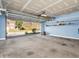 Spacious garage with overhead storage and view of the street at 11411 Shady Hollow Ln, Indianapolis, IN 46229