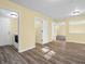 Bright hallway with light walls and wood-look flooring at 11411 Shady Hollow Ln, Indianapolis, IN 46229