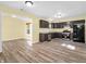 Modern kitchen with dark cabinets and stainless steel appliances at 11411 Shady Hollow Ln, Indianapolis, IN 46229