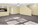 Open living room with a view into the kitchen and stairs at 11411 Shady Hollow Ln, Indianapolis, IN 46229