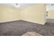 Bright living room with neutral walls and carpeting at 11411 Shady Hollow Ln, Indianapolis, IN 46229
