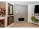 Stone fireplace with mosaic tile surround in living room at 2631 Braxton Dr, Indianapolis, IN 46229