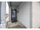 Front entry with gray door and brick and siding exterior at 2631 Braxton Dr, Indianapolis, IN 46229