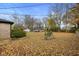 Spacious backyard with leaf-covered lawn at 3805 Byram Ave, Indianapolis, IN 46208