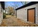 Large backyard with stone patio and detached storage shed at 3805 Byram Ave, Indianapolis, IN 46208