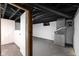 Unfinished basement with HVAC unit and storage area at 3805 Byram Ave, Indianapolis, IN 46208
