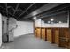 Unfinished basement with exposed utilities and a bar at 3805 Byram Ave, Indianapolis, IN 46208
