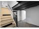 Basement access via wooden staircase at 3805 Byram Ave, Indianapolis, IN 46208