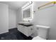 Updated bathroom featuring double marble sinks and gold accents at 3805 Byram Ave, Indianapolis, IN 46208