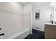Modern bathroom with subway tile, bathtub, and floating vanity at 3805 Byram Ave, Indianapolis, IN 46208