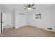 Well-lit bedroom featuring a double door closet and access to another room at 3805 Byram Ave, Indianapolis, IN 46208