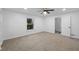 Spacious bedroom with window and access to another room at 3805 Byram Ave, Indianapolis, IN 46208