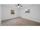 Spacious bedroom with neutral carpeting and ceiling fan at 3805 Byram Ave, Indianapolis, IN 46208