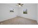 Spacious bedroom with two windows and ceiling fan at 3805 Byram Ave, Indianapolis, IN 46208