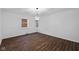 Dining room with dark hardwood floors and chandelier at 3805 Byram Ave, Indianapolis, IN 46208