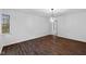 Bright dining room with hardwood floors and modern light fixture at 3805 Byram Ave, Indianapolis, IN 46208