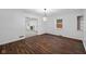 Dining room with dark hardwood floors, chandelier and view to living room at 3805 Byram Ave, Indianapolis, IN 46208