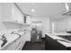 Sleek kitchen with stainless steel refrigerator and quartz countertops at 3805 Byram Ave, Indianapolis, IN 46208